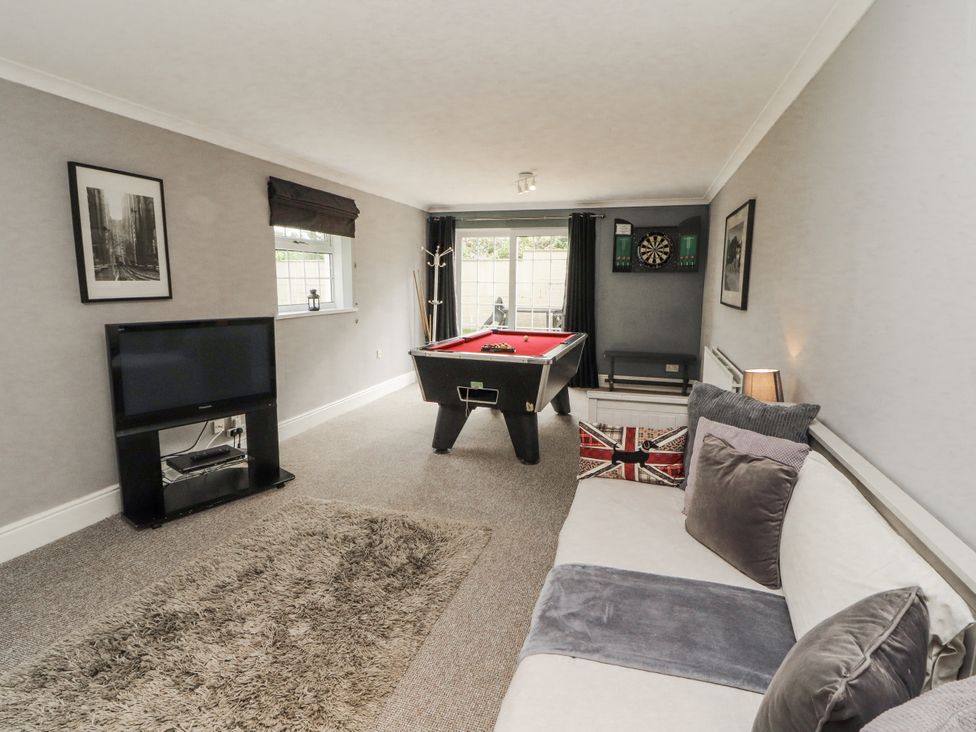 A snug with a pool table and a dartboard at White Gables in Great Clifton near Cockermouth