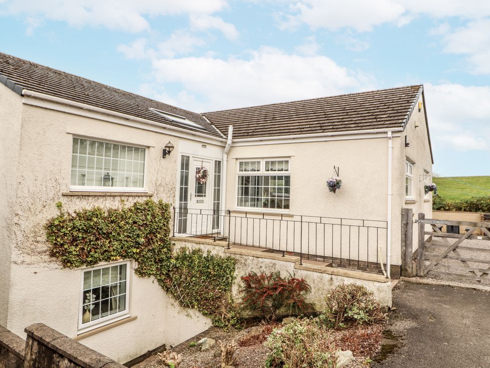 A house with a front door and windows at White Gables Great Clifton near Cockermouth