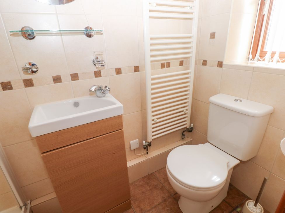 A bathroom with a sink and toilet at Bwthyn Trecoed St. Clears near Carmarthen