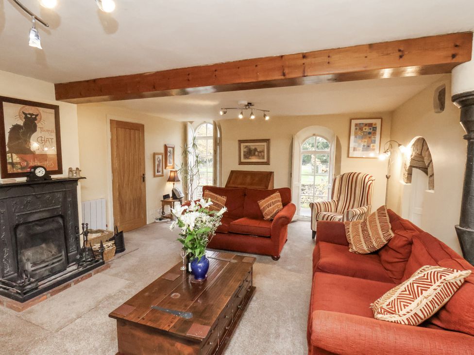 A living room with sofas and a fireplace at 1 The Old Methodist Chapel Rosedale Abbey