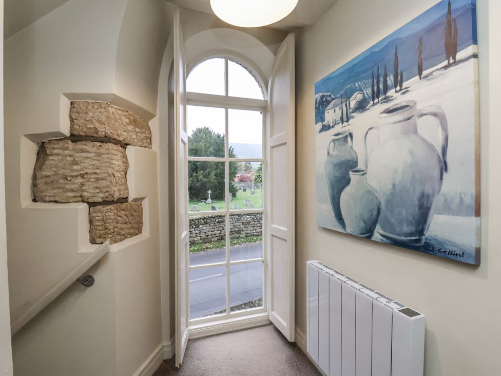 An entrance hall with a window and painting at 1 The Old Methodist Chapel Rosedale Abbey