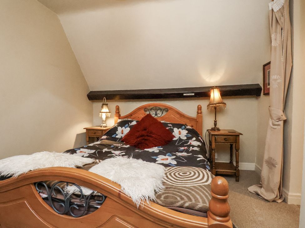 A bedroom with a bed and bedside table at 1 The Old Methodist Chapel Rosedale Abbey