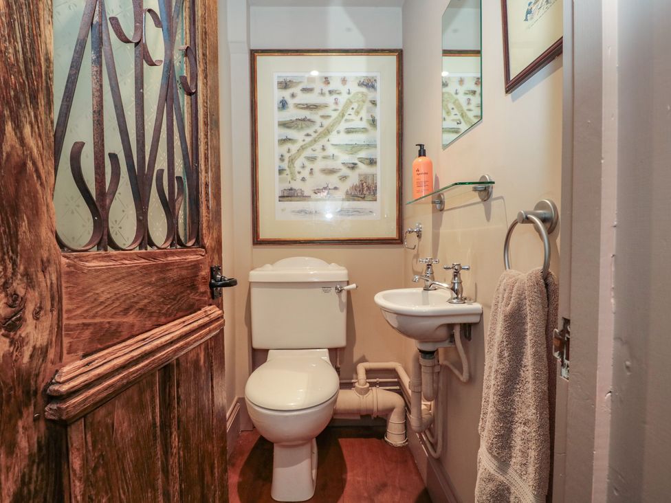 A bathroom with a toilet and sink at The Lodge Farm Barn in Deepdean near Ross-on-Wye