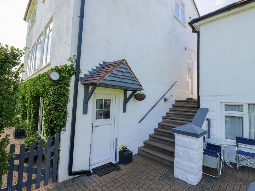 A stairway leading up to a door with a planter at Severn Bank Lodge in Astley Burf near Stourport-on-Severn
