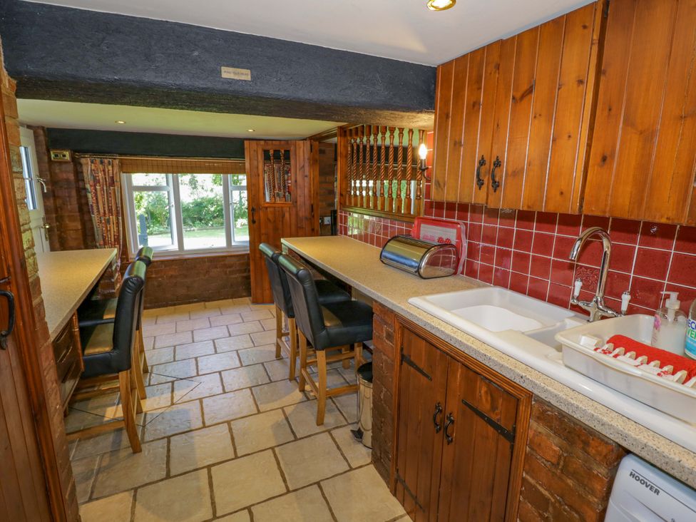 A kitchen with a sink and cabinets at Severn Bank Lodge in Astley Burf near Stourport-on-Severn