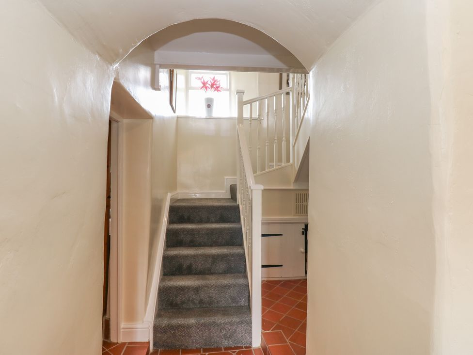 A staircase in a hallway at High Smarber in Low Row near Reeth