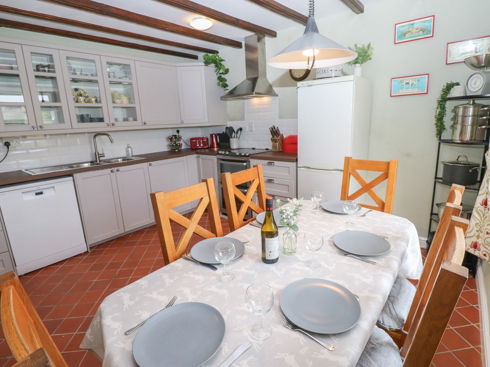 A kitchen with a dining area setup at High Smarber in Low Row near Reeth