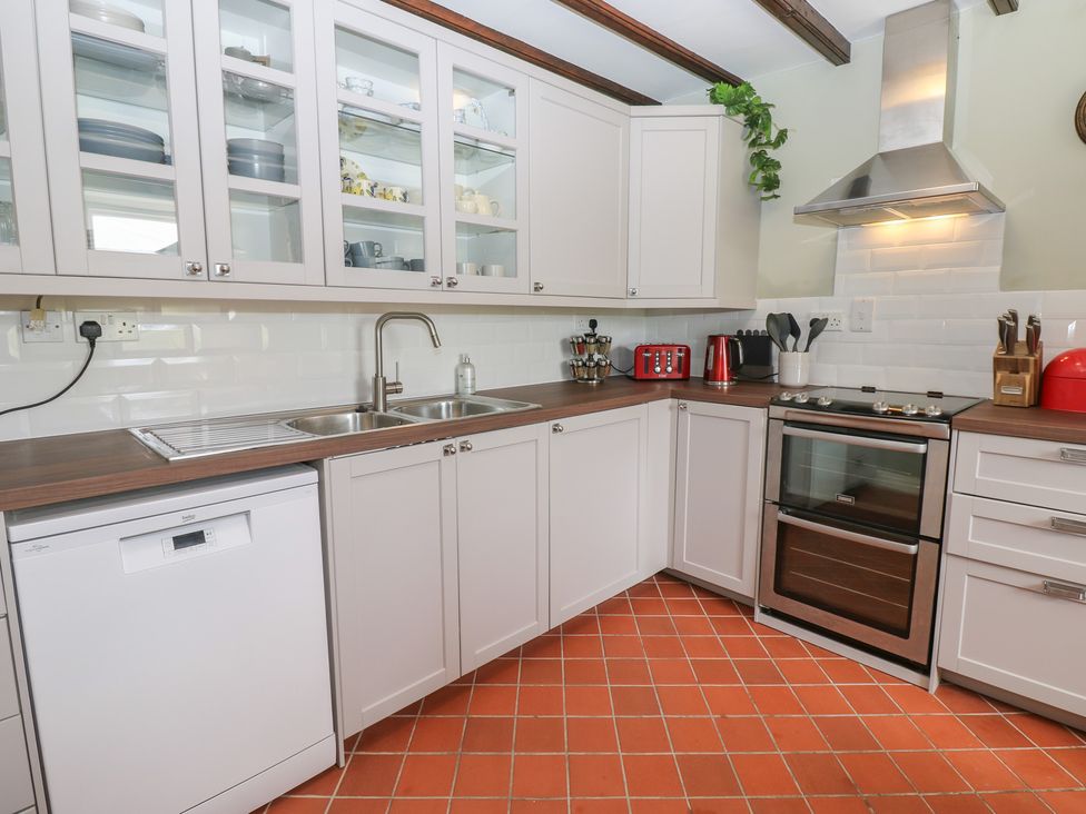 A kitchen with cabinets and appliances at High Smarber in Low Row near Reeth