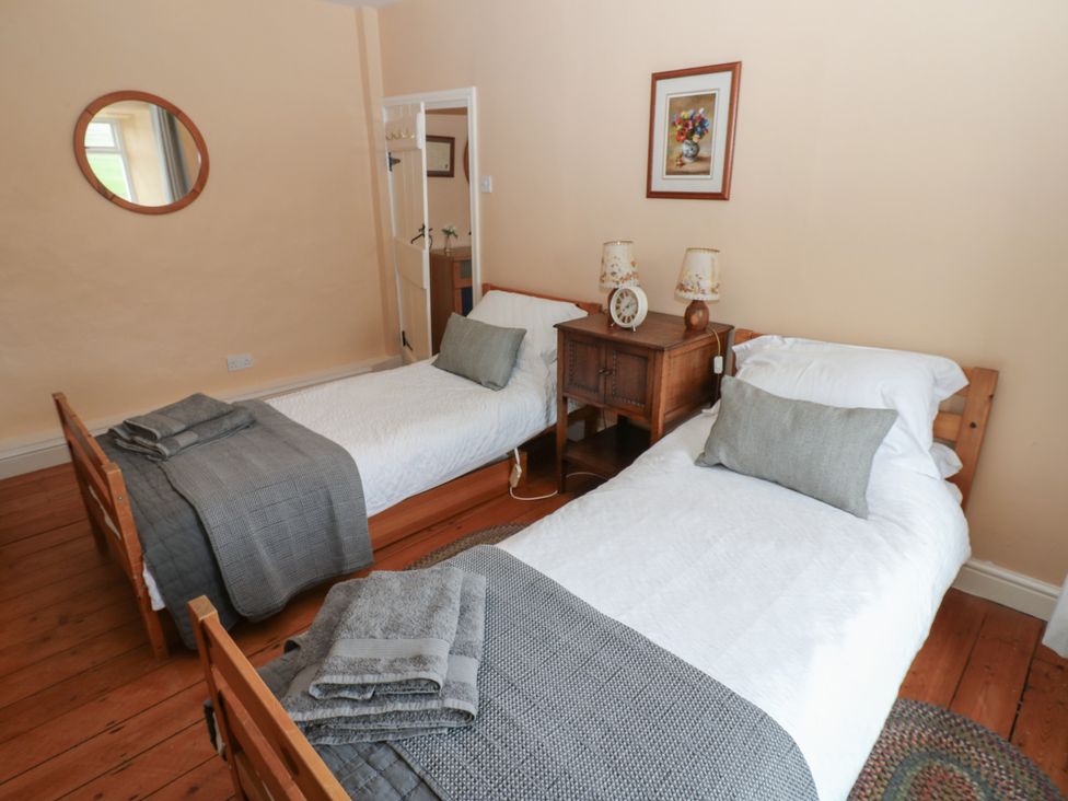 A bedroom with two single beds at High Smarber in Low Row near Reeth