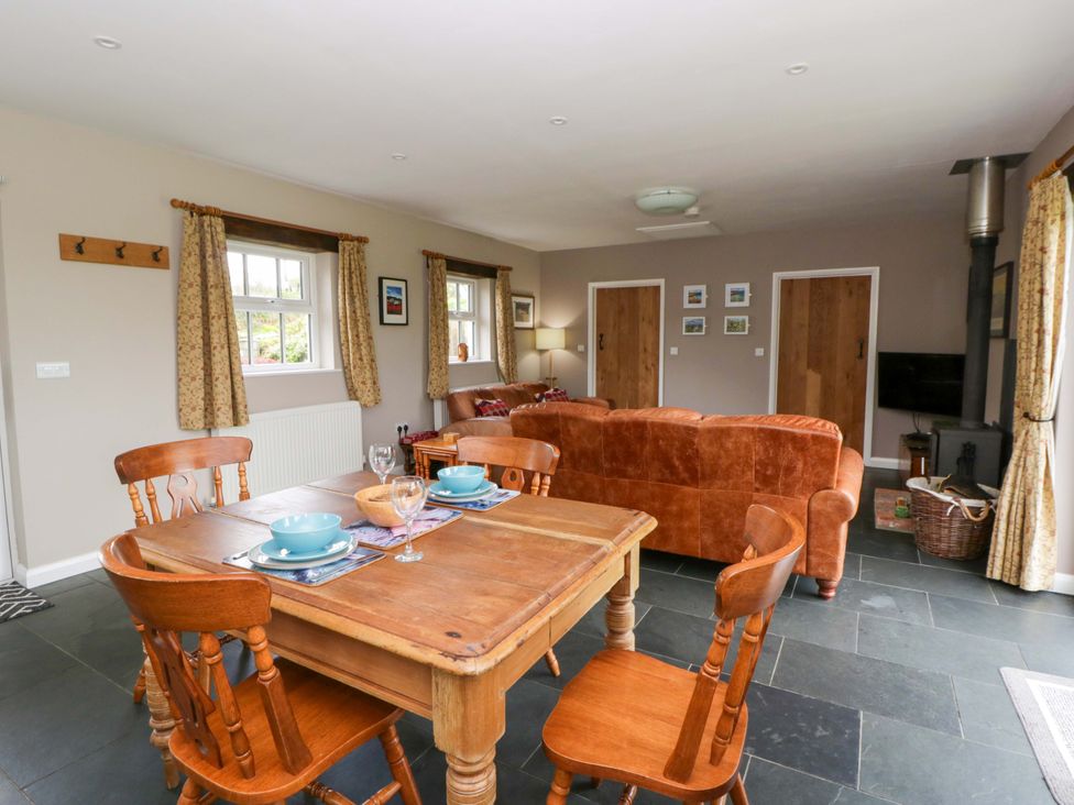A living room with a table and chairs at Blaenffynnon Bach in Trelech near Crymych