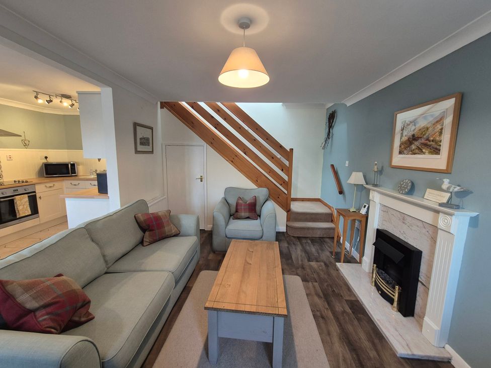 A living room with a sofa and fireplace at Westgate Cottage in Pickering