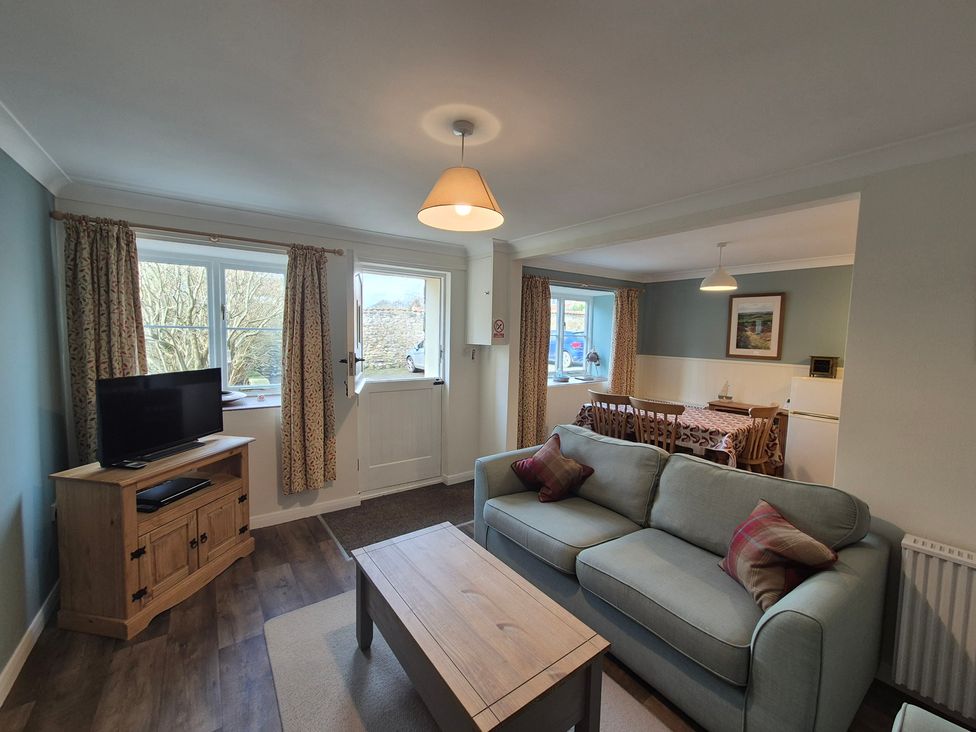 A living room with a sofa and television at Westgate Cottage in Pickering