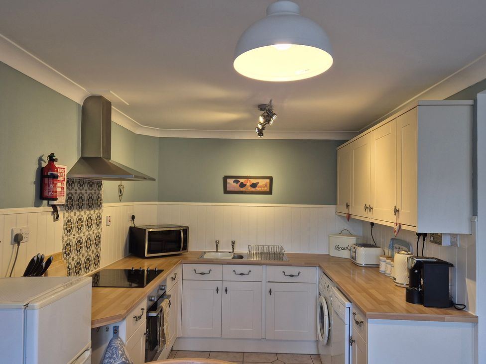 A kitchen with appliances and a sink at Westgate Cottage in Pickering