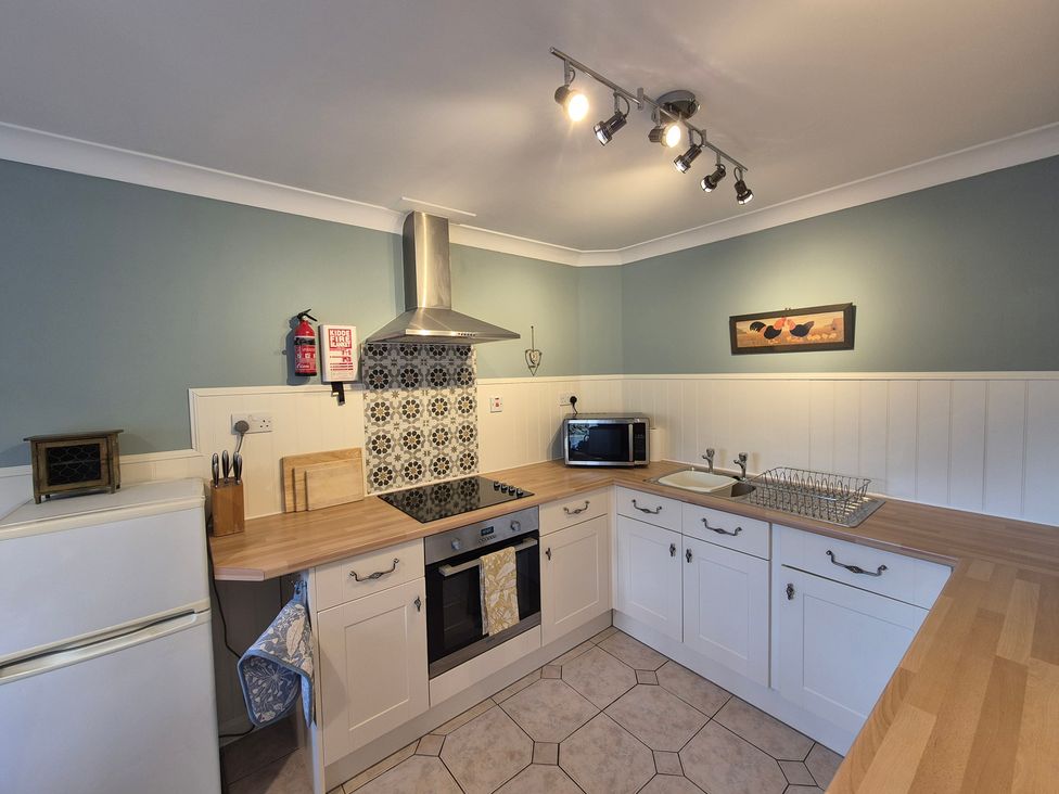 A kitchen with appliances and fixtures at Westgate Cottage in Pickering