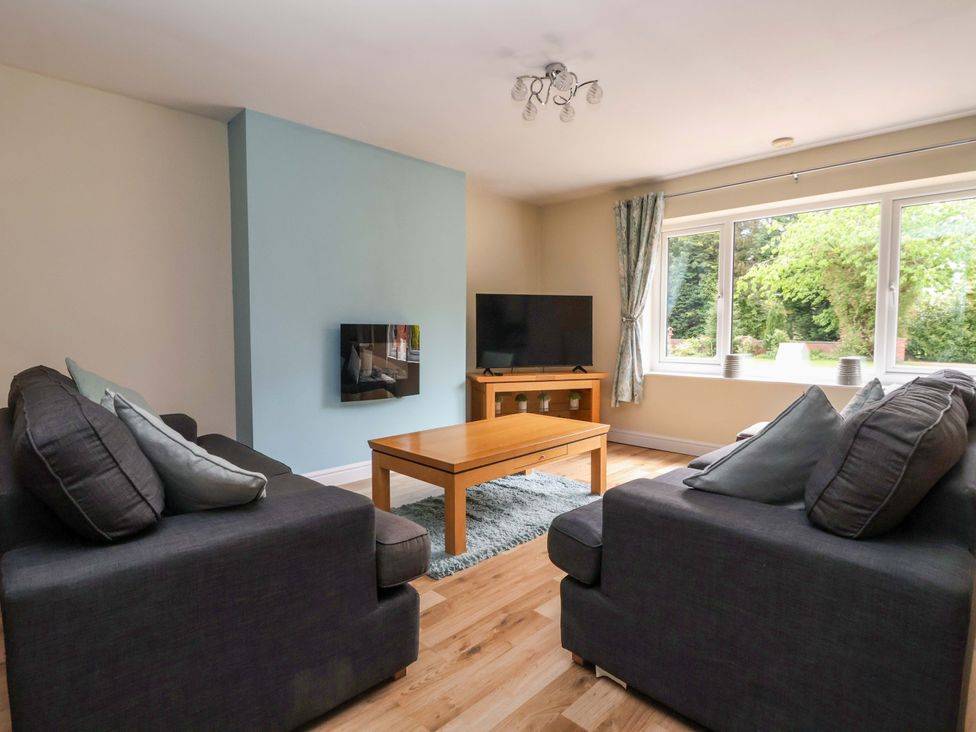 A living room with a sofa and television at The Granary in York