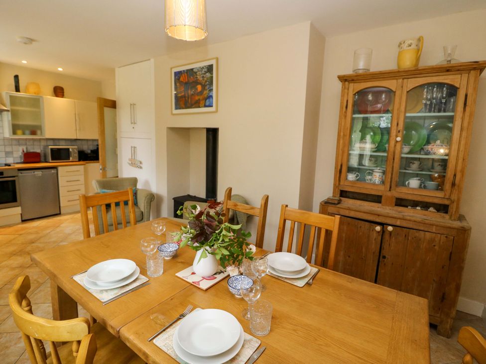 A dining room with a wooden table and chairs at Rowantree, Beaufort, County Kerry