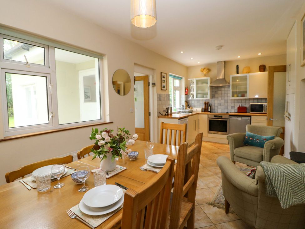 A kitchen with dining table and chairs at Rowantree in Beaufort, County Kerry