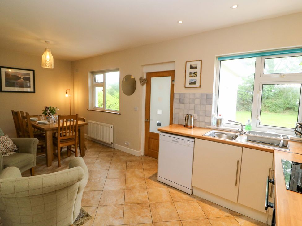 A kitchen with dining area and appliances at Rowantree, Beaufort, County Kerry