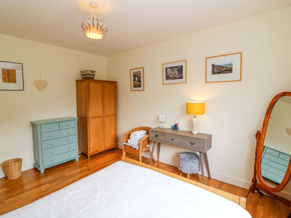 A bedroom with a bed and furniture at Rowantree, Beaufort, County Kerry