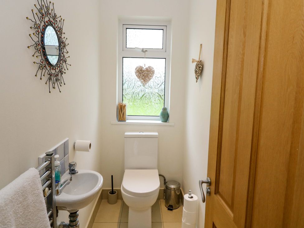 A bathroom with a sink and toilet at Rowantree, Beaufort, County Kerry