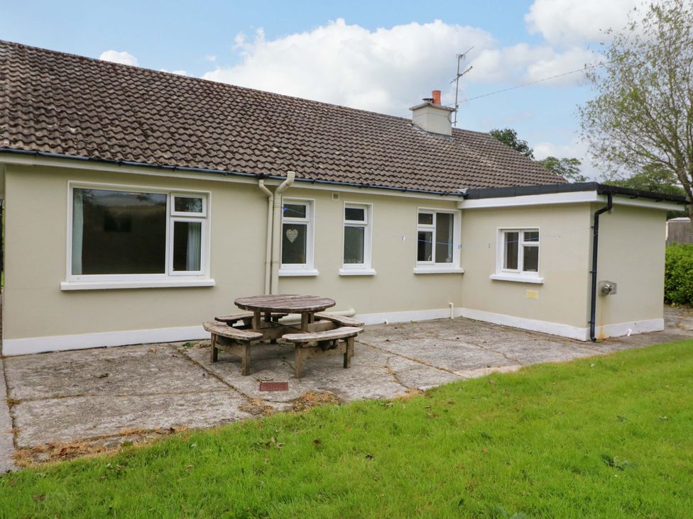 A house with a patio and seating at Rowantree in Beaufort, County Kerry