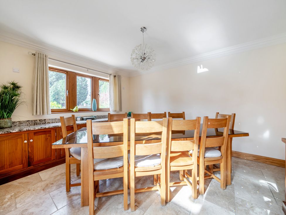 A dining room with a table and chairs at Manor House in Chesterfield