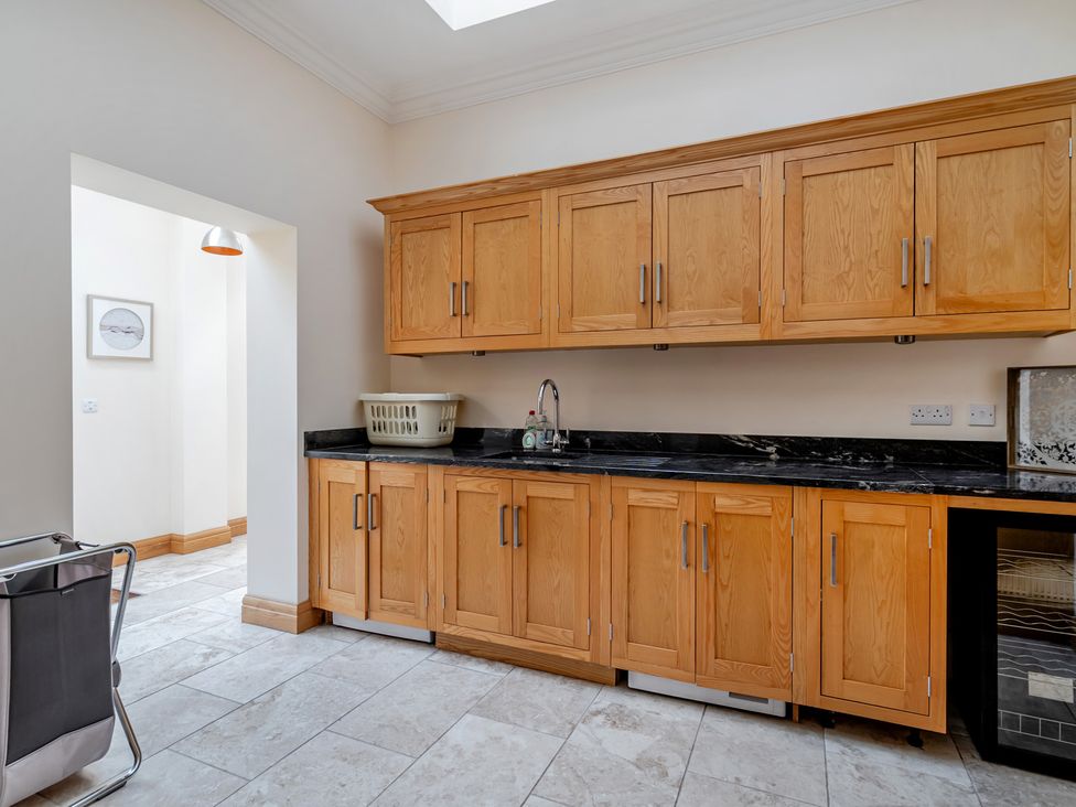 A kitchen with cabinets and a sink at Manor House in Chesterfield