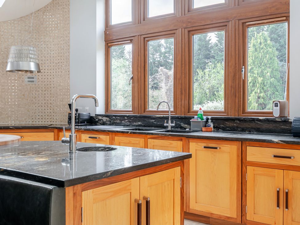 A kitchen featuring wooden cabinets and a sink at the Manor House in Chesterfield