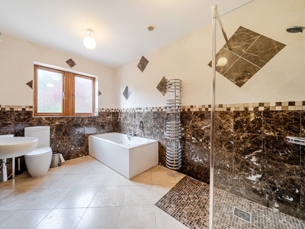 A bathroom with a bathtub and shower at Manor House in Chesterfield