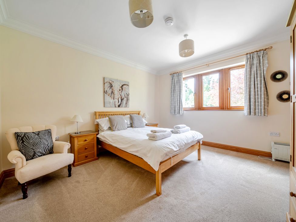 A bedroom with a bed and nightstand at Manor House in Chesterfield