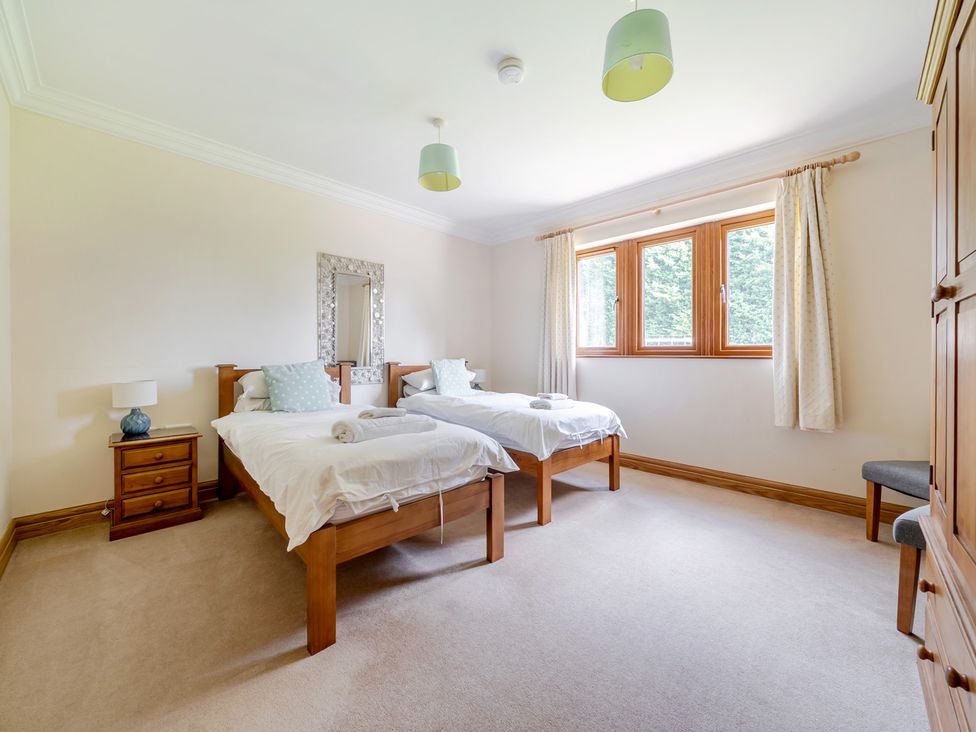 A bedroom with two beds and a window at Manor House Chesterfield