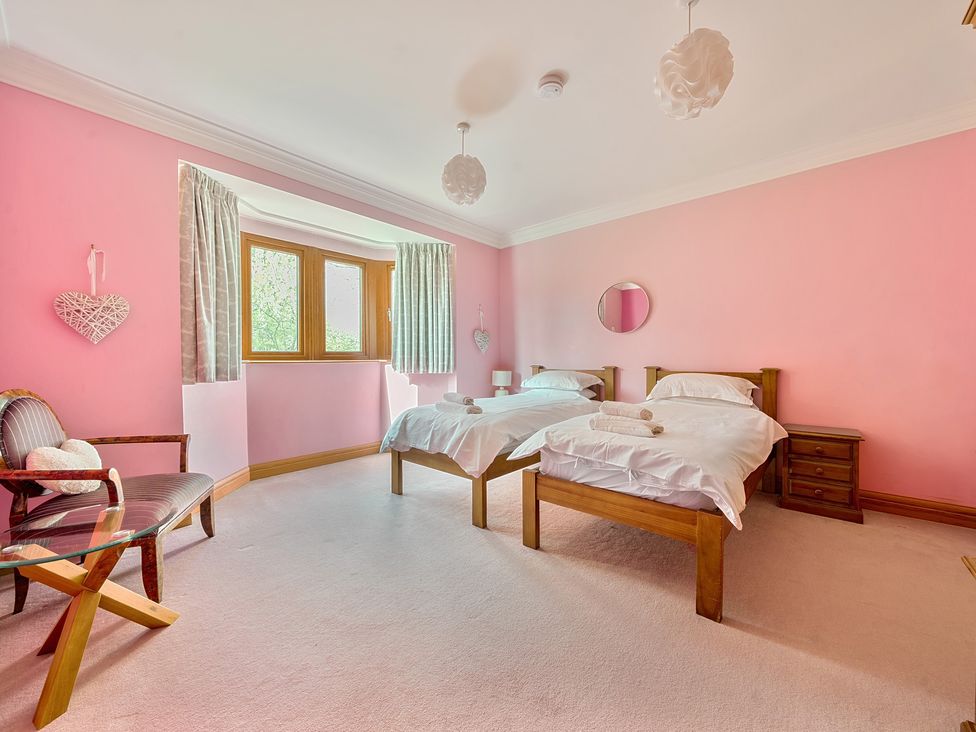 A bedroom with two beds and a window at Manor House in Chesterfield