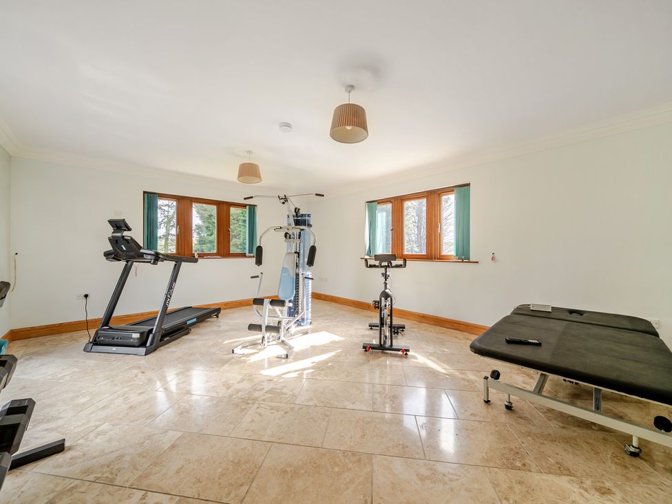 A gym with fitness equipment at Manor House in Chesterfield
