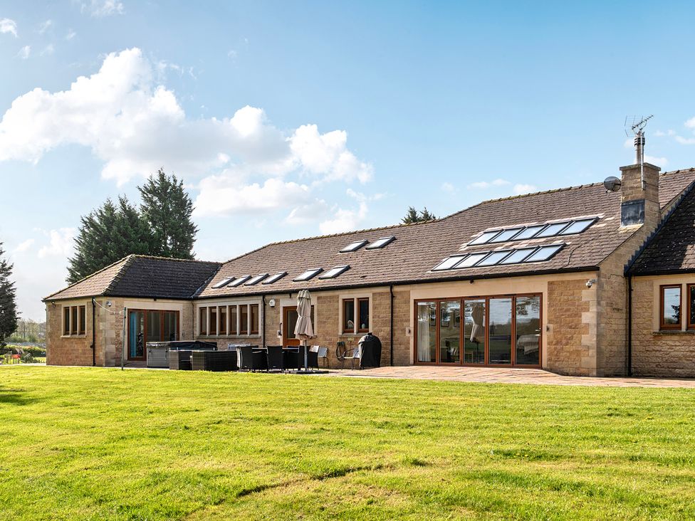 A house exterior with a patio and yard at Manor House in Chesterfield