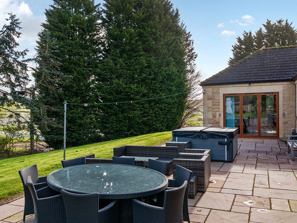 An outdoor dining area with a table and chairs at Manor House Chesterfield
