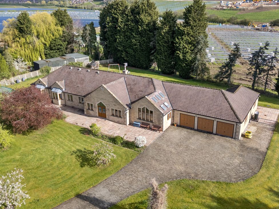 An aerial view of a house with a driveway and garden at Manor House in Chesterfield
