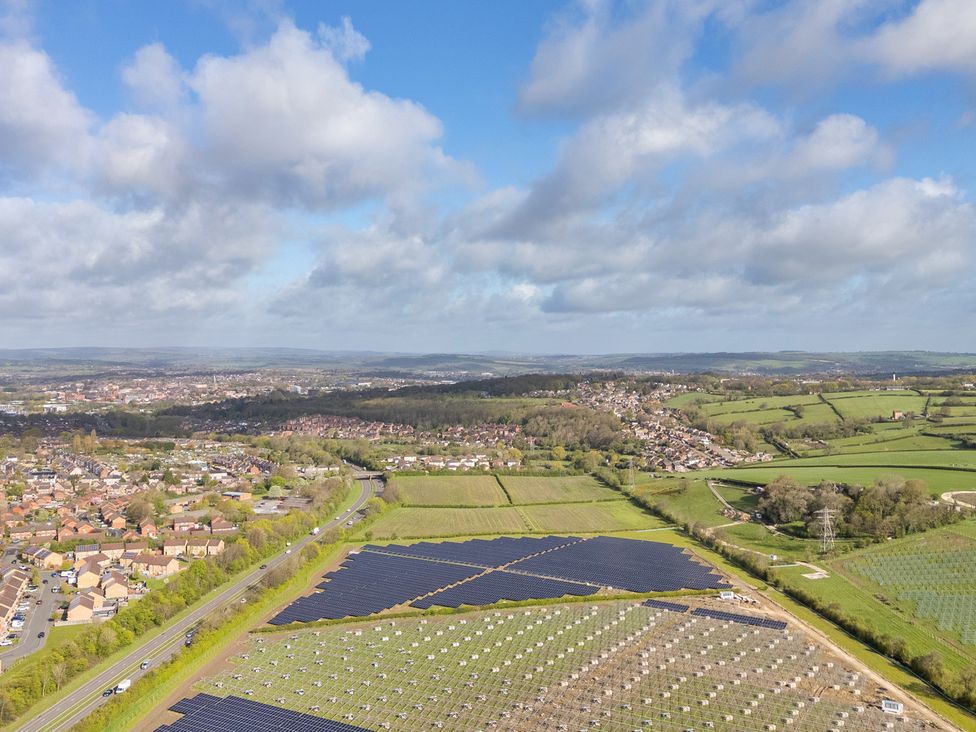 An aerial view of solar panels and urban areas at Manor House Chesterfield