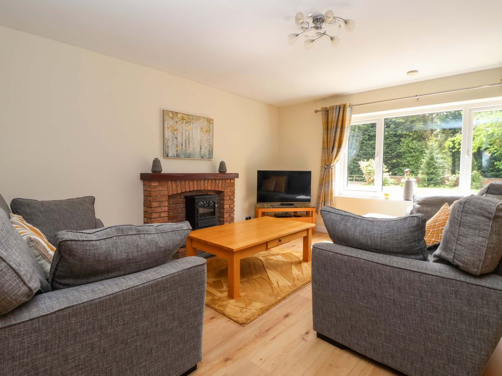 A living room with a sofa and coffee table at The Milking Parlour in York