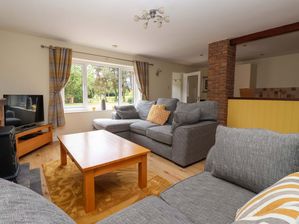A living room with a sofa and coffee table at The Milking Parlour in York