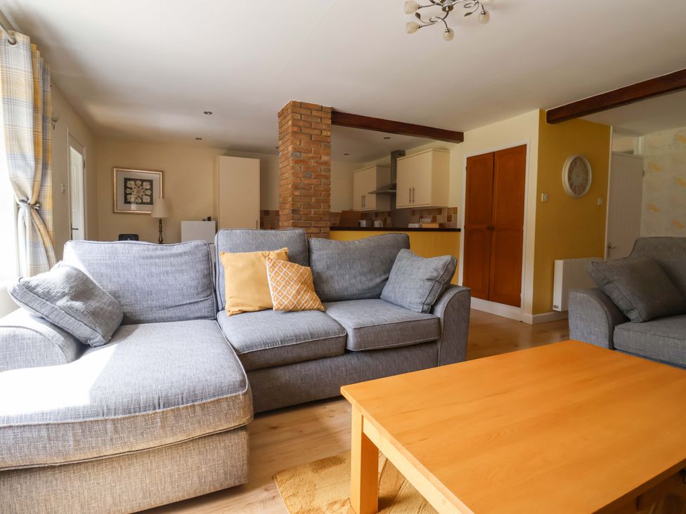 A living room with a sofa and coffee table at The Milking Parlour in York