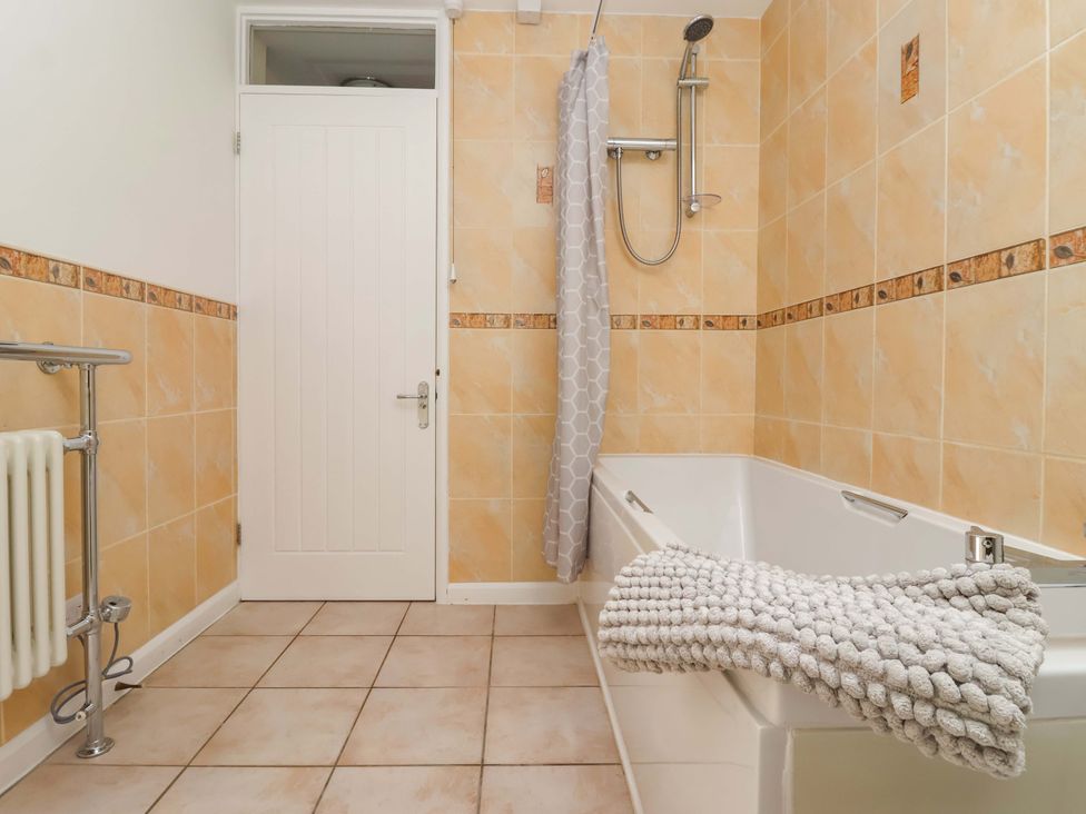 A bathroom with bathtub and shower at The Milking Parlour in York