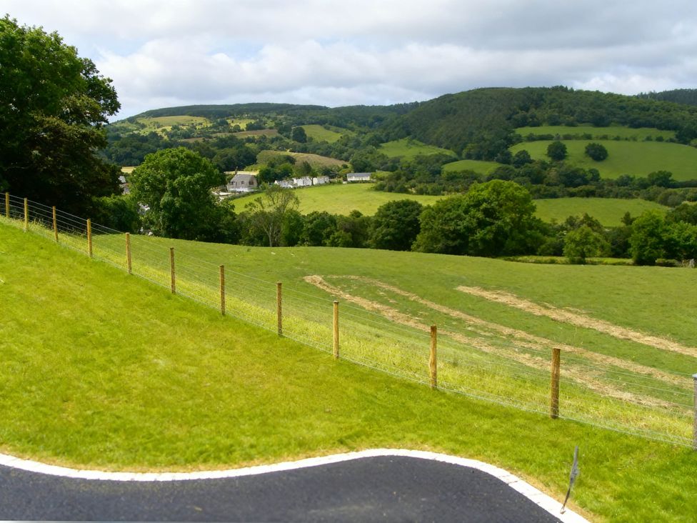 A view of hills and fields with a fence at Tyn Y Celyn Canol Clocaenog near Ruthin