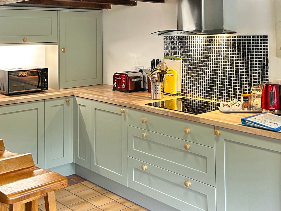 A kitchen with a microwave, toaster, and kettle at Broadhay Offerton near Hathersage