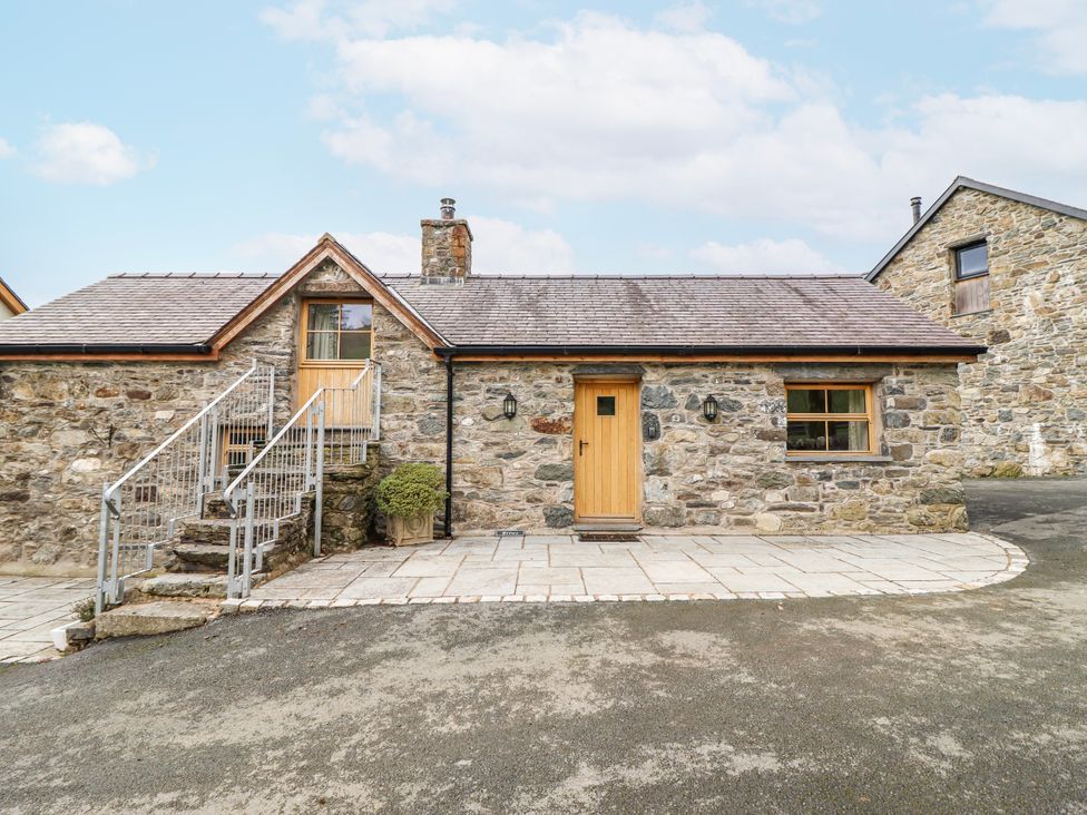 A stone house with steps and wooden door at Briws and 963354 together they sleep 35