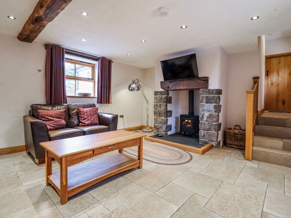 A living room with a sofa and coffee table at Briws and 963354 together they sleep 35