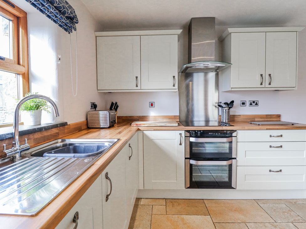 A kitchen with sink and oven at Briws and 963354 together they sleep 35