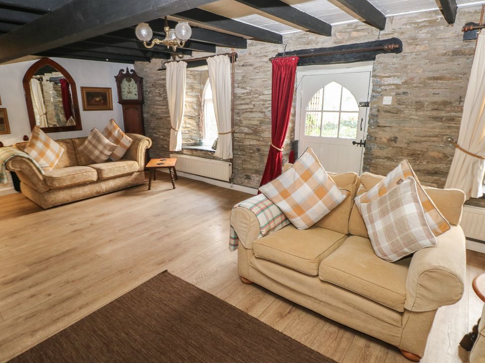A living room with sofas and a coffee table at Maesgwyn in Bridell near Cardigan