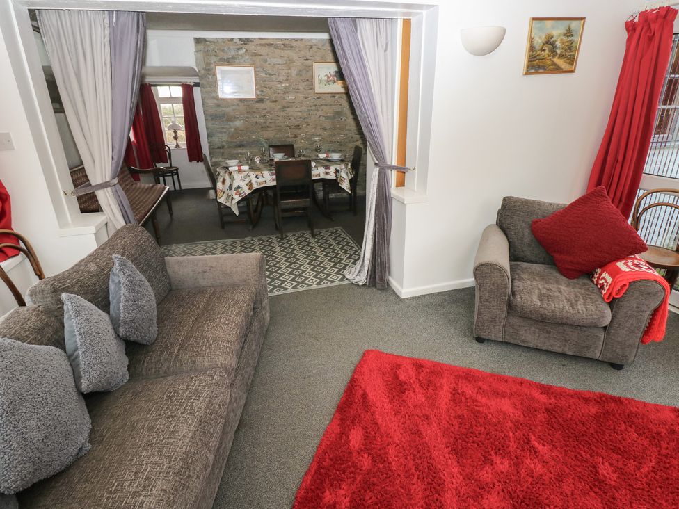 A living room with seating area and dining space at Maesgwyn in Bridell near Cardigan