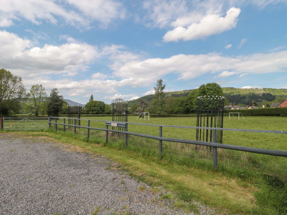 A field with goal posts and a fence at Longside in Gilwern
