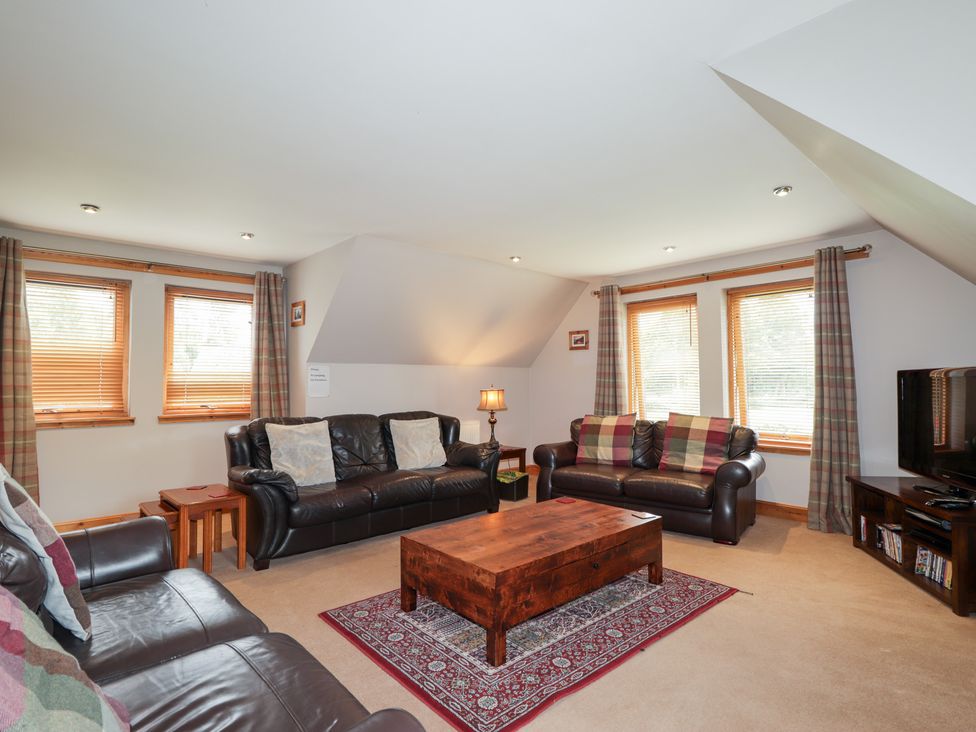 A living room with sofas and a coffee table at An Torr in Newtonmore